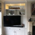 Custom Painted Alcove Unit in Strong White with Mirrored Back and TV