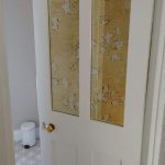 White Internal Door with Antique Mirror Panels and Patterned Bathroom Tiles
