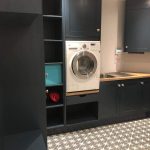 Navy Painted Shaker Utility Room with Patterned Floor Tile and Wood Effect Worktop